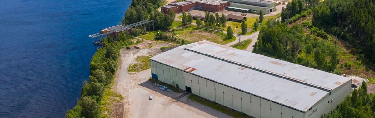 Factory buildings beside the lake in Billingsfors, Sweden, the site of RETYRA’s planned first factory